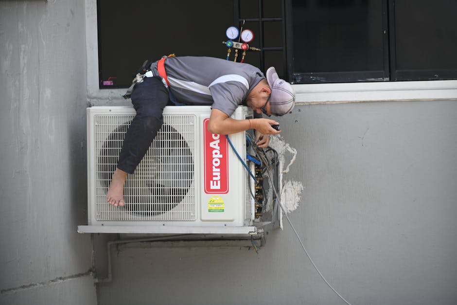Smiling HVAC technician providing heating and cooling service